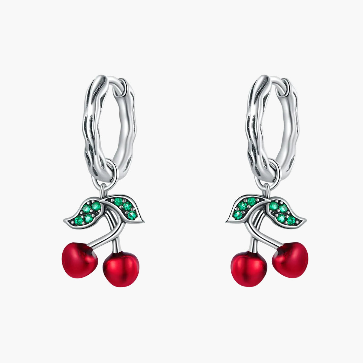 Cherry-themed earrings with red and green stones on a white background