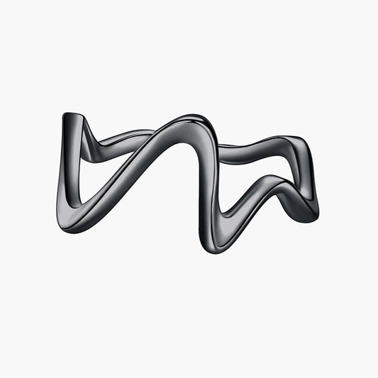 Silver ring with a wavy design on a white background