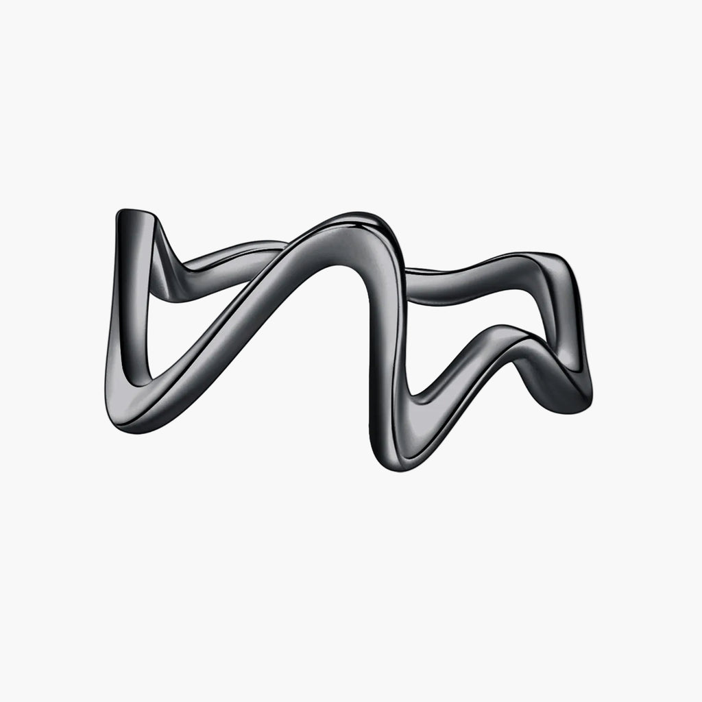Silver ring with a wavy design on a white background